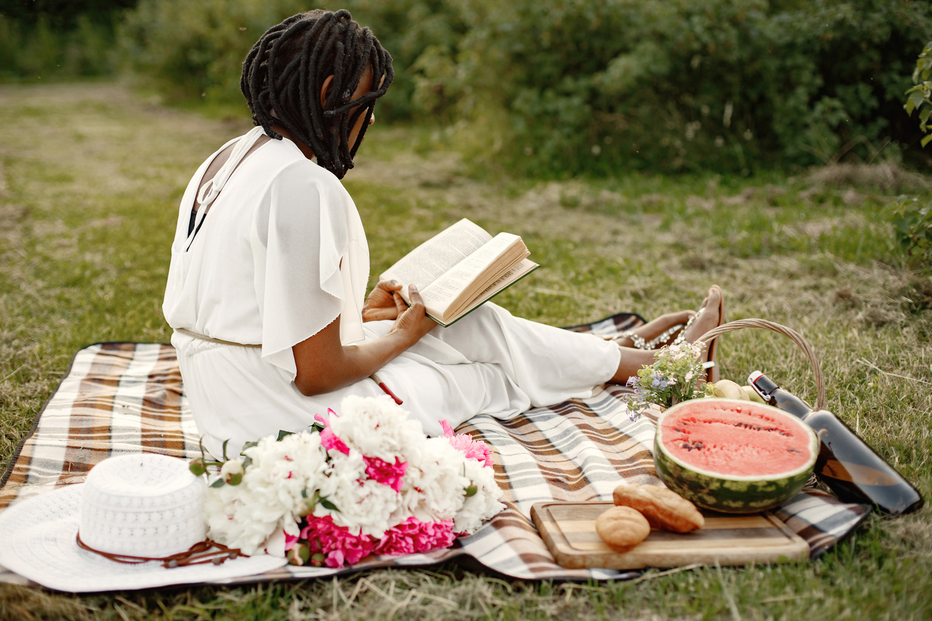 Woman Reading a Book on a Picnic